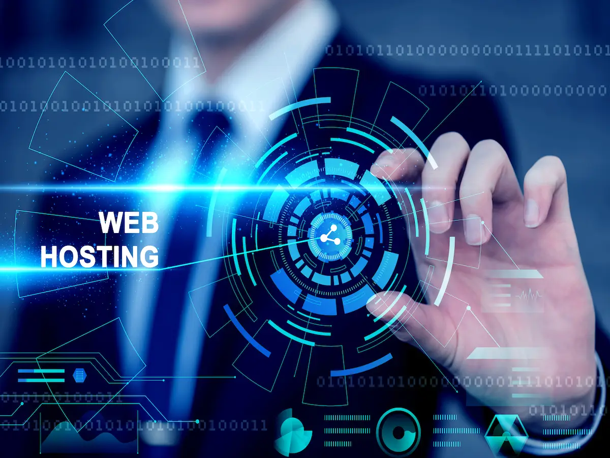 A man's hand on a visual digital display with a web hosting written on it