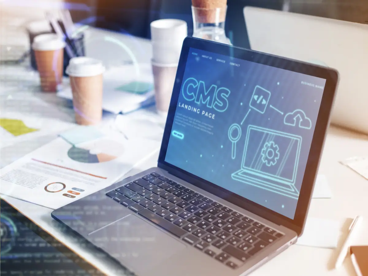 A laptopn with a CMS management showing on the screen